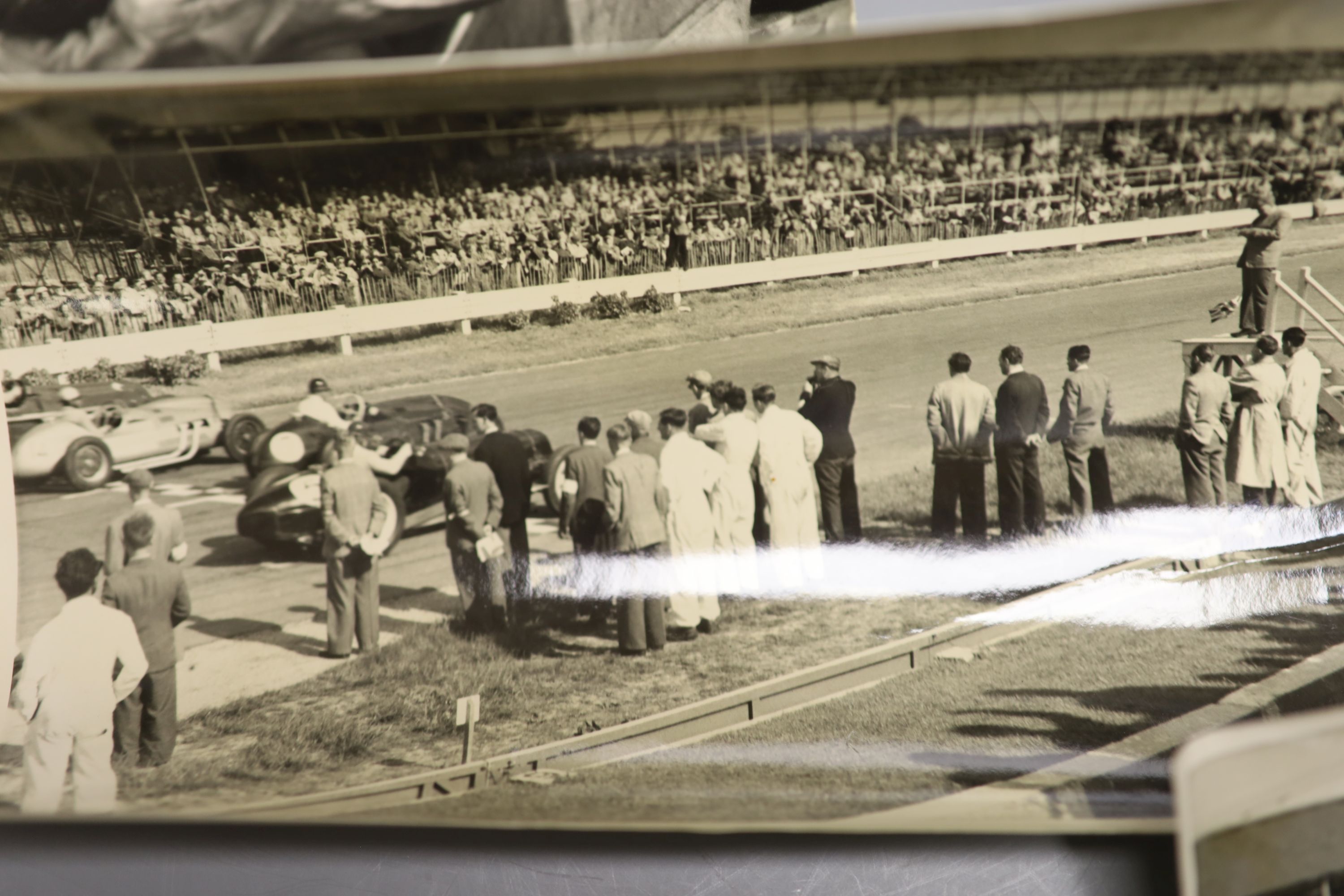 Daphne Rice - motor racing interest, four monochrome photographs of Mike Hawthorn, one signed